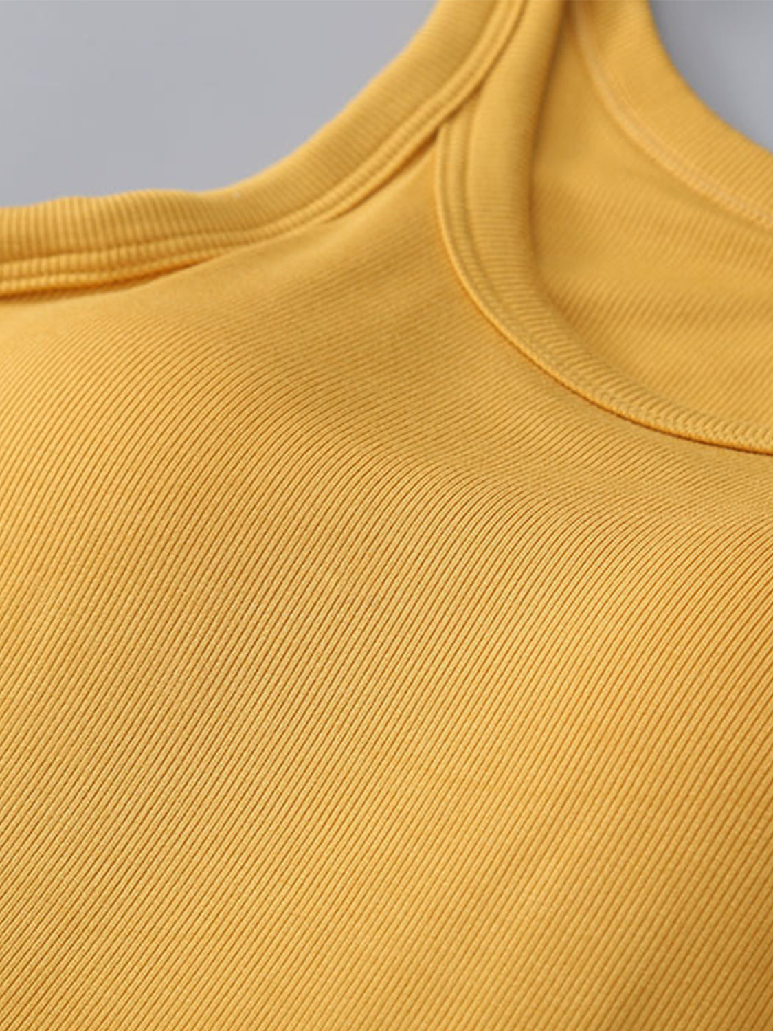 Yellow round neck tank with bra, viscose and spandex blend, moderate stretch.