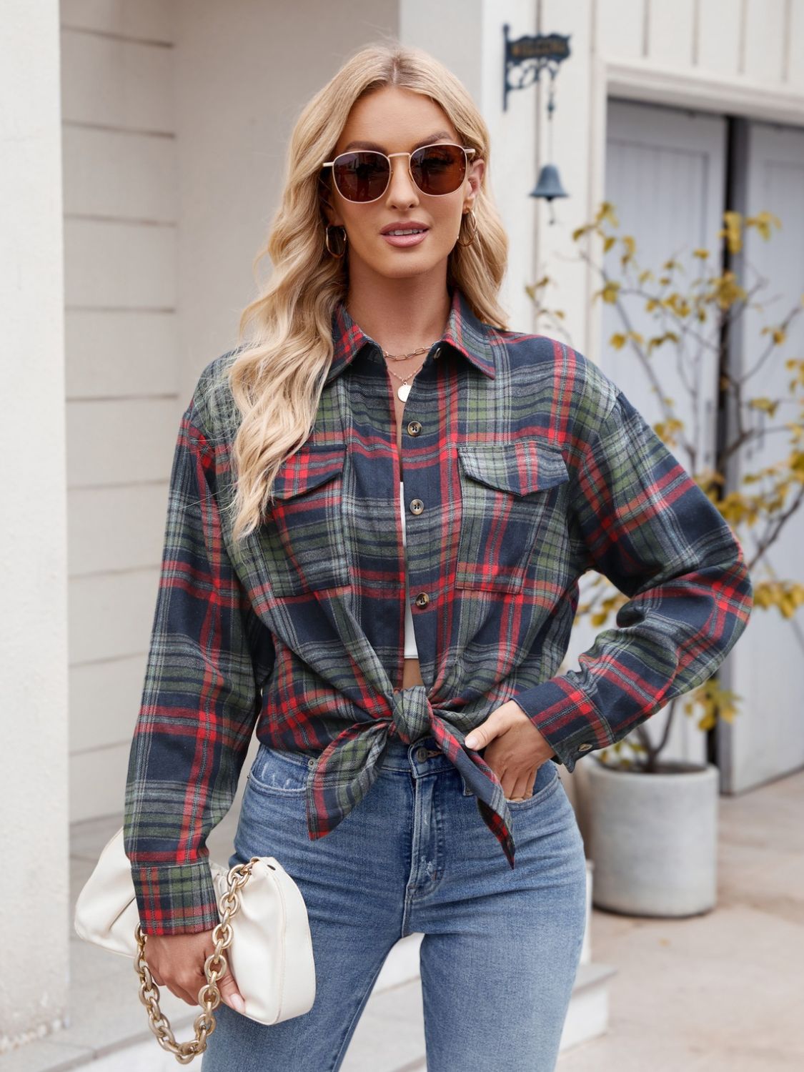 Mandy Plaid Button Up Long Sleeve Shirt with pockets and buttoned front, worn by model with sunglasses.