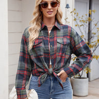 Mandy Plaid Button Up Long Sleeve Shirt with pockets and buttoned front, worn by model with sunglasses.