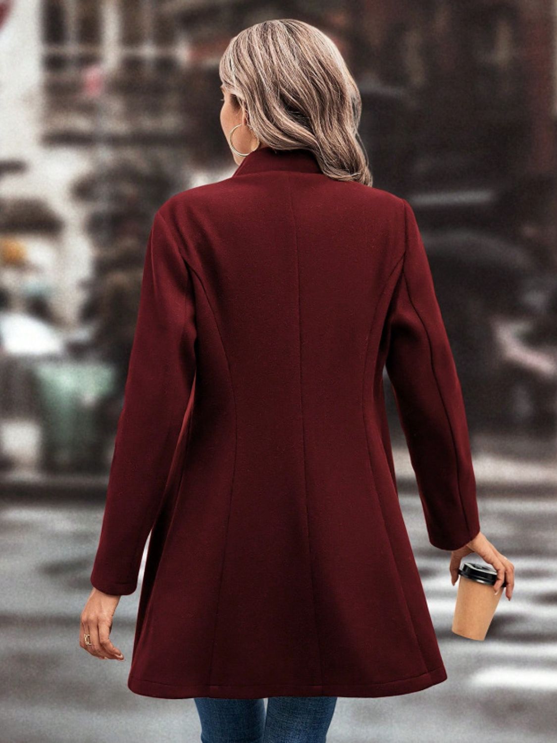 Collared Neck Button Up Long Sleeve Coat in maroon worn by a woman holding a coffee cup.