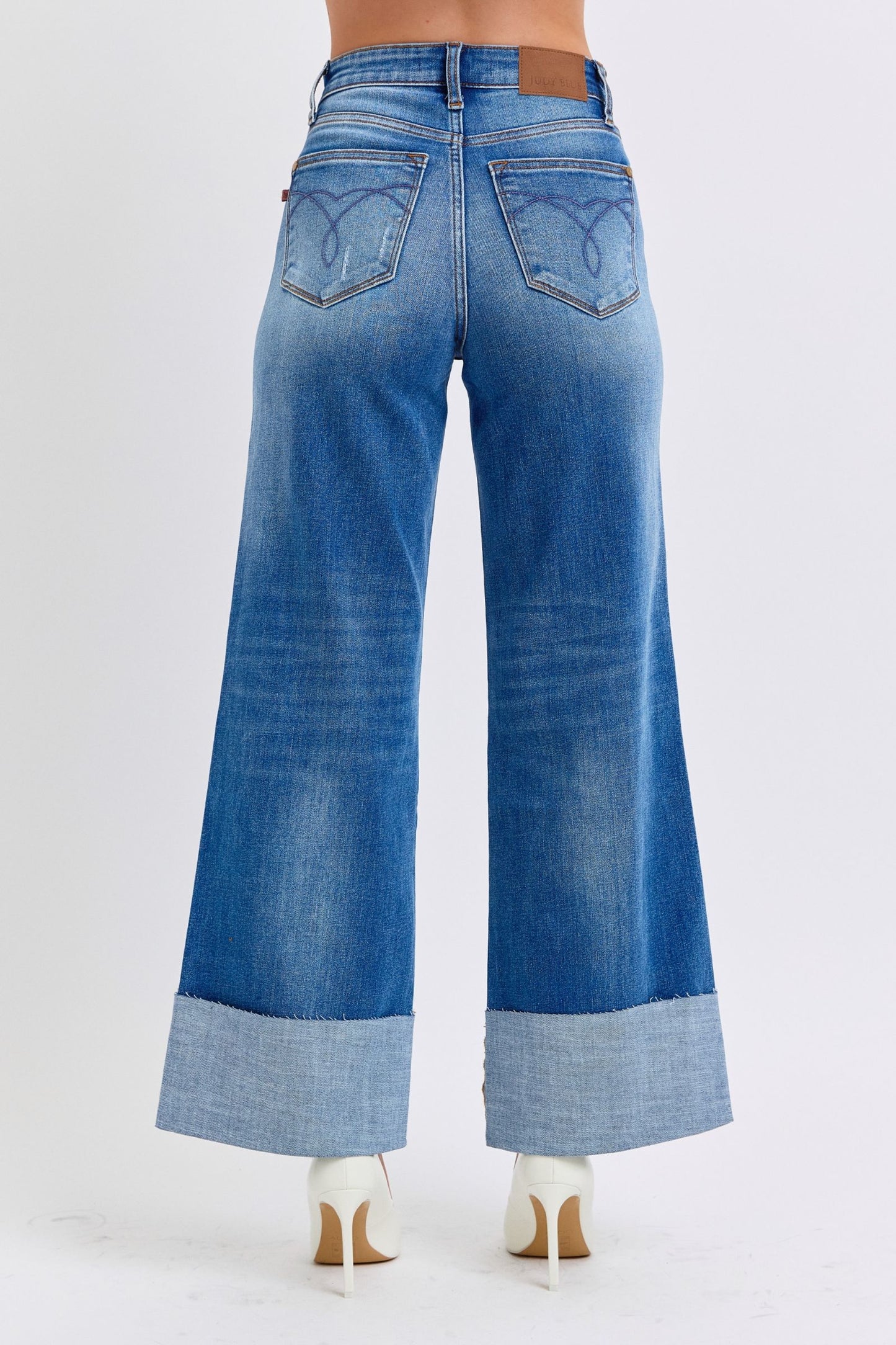 Judy Blue distressed high waist wide leg jeans with cuffed hems, back view.