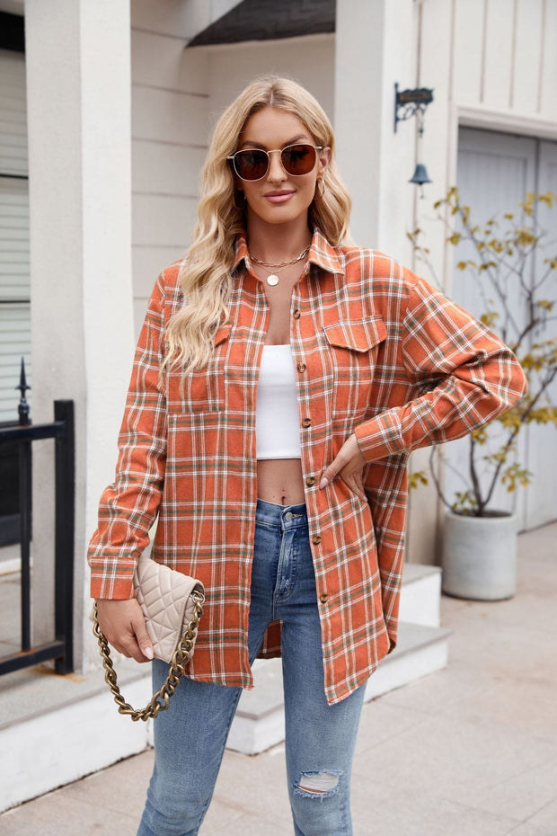 Mandy Plaid Button Up Long Sleeve Shirt in orange, featuring buttons and pockets, worn by a model with jeans.