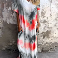 Full size pocketed tie-dye short sleeve dress in vibrant colors, featuring a slightly stretchy material.